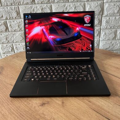 Ігровий ноутбук Б-клас MSI GS65 8RF Stealth Thin / 15.6" (1920x1080) IPS / Intel Core i7-8750H (6 (12) ядра по 2.2 - 4.1 GHz) / 16 GB DDR4 / 512 GB SSD / nVidia GeForce GTX 1070 Max-Q, 8 GB GDDR5, 256-bit / WebCam