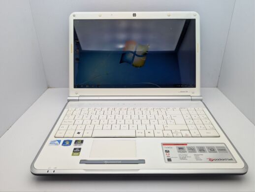 Ноутбук Packard Bell TJ66 / 15.6" (1366x768) TN / Intel Pentium T4300 (2 ядра по 2.1 GHz) / 4 GB DDR2 / 320 GB HDD / nVidia GeForce G210M, 512 MB GDDR3, 64-bit / WebCam / DVD-ROM