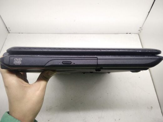 Ноутбук клас Б Asus K50C / 15.6" (1366x768) TN / Intel Celeron 220 (1 ядра по 1.2 GHz) / 2 GB DDR2 / 80 GB HDD / SIS Mirage 3+ 672MX / WebCam / DVD-RW / АКБ не тримає