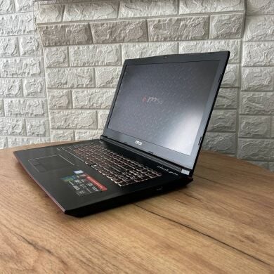 Игровой ноутбук MSI GE72MVR 7RG Apache Pro / 17.3" (1920x1080) IPS / Intel Core i7-7700HQ (4 (8) ядра по 2.8 - 3.8 GHz) / 16 GB DDR4 / 128 GB SSD + 1000 GB HDD / nVidia GeForce GTX 1070, 8 GB GDDR5, 256-bit / WebCam Игровой ноутбук MSI GE72MVR 7RG Apache Pro / 17.3" (1920x1080) IPS / Intel Core i7-7700HQ (4 (8) ядра по 2.8 - 3.8 GHz) / 16 GB DDR4 / 128 GB SSD + 1000 GB HDD / nVidia GeForce GTX 1070, 8 GB GDDR5, 256-bit / WebCam