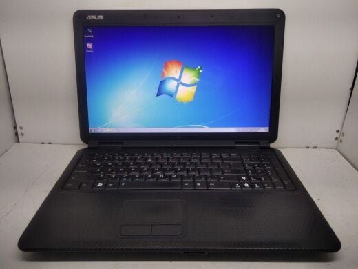 Ноутбук клас Б Asus K50C / 15.6" (1366x768) TN / Intel Celeron 220 (1 ядра по 1.2 GHz) / 2 GB DDR2 / 80 GB HDD / SIS Mirage 3+ 672MX / WebCam / DVD-RW / АКБ не тримає