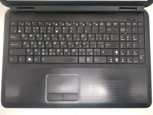 Ноутбук клас Б Asus K50C / 15.6" (1366x768) TN / Intel Celeron 220 (1 ядра по 1.2 GHz) / 2 GB DDR2 / 80 GB HDD / SIS Mirage 3+ 672MX / WebCam / DVD-RW / АКБ не тримає