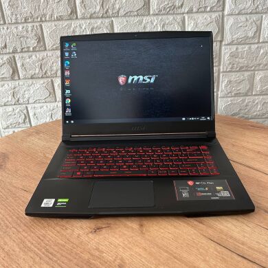 Ігровий ноутбук MSI GF63 Thin 10SDR / 15.6" (1920x1080) IPS / Intel Core i7-10750H (6 (12) ядер по 2.6 - 5.0 GHz) / 16 GB DDR4 / 256 GB SSD / nVidia GeForce GTX 1660 Ti, 6 GB GDDR6, 192-bit / WebCam Ігровий ноутбук MSI GF63 Thin 10SDR / 15.6" (1920x1080) IPS / Intel Core i7-10750H (6 (12) ядер по 2.6 - 5.0 GHz) / 16 GB DDR4 / 256 GB SSD / nVidia GeForce GTX 1660 Ti, 6 GB GDDR6, 192-bit / WebCam