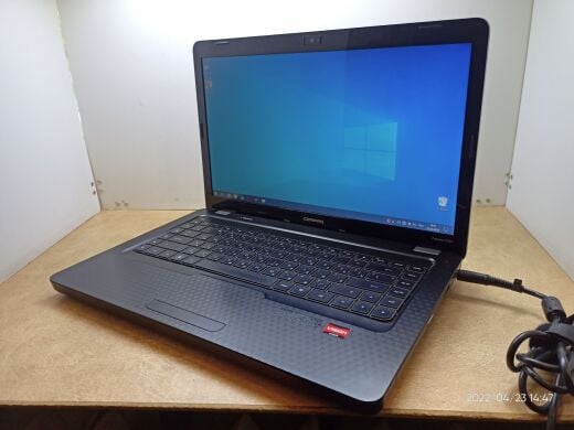 Ноутбук HP Compaq Presario CQ62 / 15.6" (1366x768) TN / AMD Athlon II P320 (2 ядра по 2.1 GHz) / 4 GB DDR3 / 320 GB HDD / AMD Radeon HD 4250 Graphics / DVD-ROM / Без АКБ 