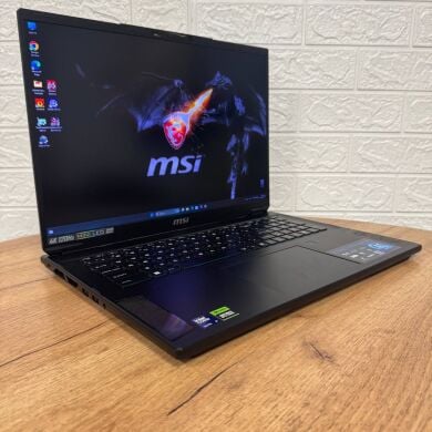 Игровой ноутбук Б-класс MSI Stealth 18 AI Studio A1VHG / 18" (3840x2400) IPS / Intel Core Ultra 9 185H (16 (22) ядер по 1.8 - 5.1 GHz) / 32 GB DDR5 / 1000 GB SSD / nVidia GeForce RTX 4080, 12 GB GDDR6, 192-bit / WebCam Игровой ноутбук Б-класс MSI Stealth 18 AI Studio A1VHG / 18" (3840x2400) IPS / Intel Core Ultra 9 185H (16 (22) ядер по 1.8 - 5.1 GHz) / 32 GB DDR5 / 1000 GB SSD / nVidia GeForce RTX 4080, 12 GB GDDR6, 192-bit / WebCam