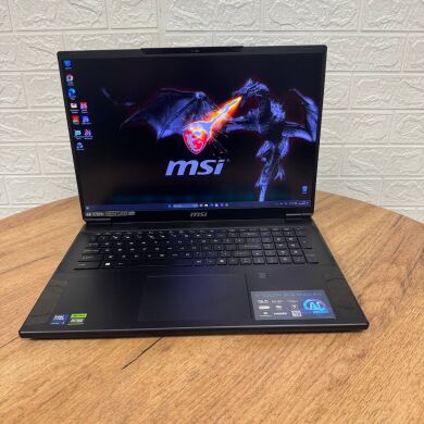 Игровой ноутбук Б-класс MSI Stealth 18 AI Studio A1VHG / 18" (3840x2400) IPS / Intel Core Ultra 9 185H (16 (22) ядер по 1.8 - 5.1 GHz) / 32 GB DDR5 / 1000 GB SSD / nVidia GeForce RTX 4080, 12 GB GDDR6, 192-bit / WebCam Игровой ноутбук Б-класс MSI Stealth 18 AI Studio A1VHG / 18" (3840x2400) IPS / Intel Core Ultra 9 185H (16 (22) ядер по 1.8 - 5.1 GHz) / 32 GB DDR5 / 1000 GB SSD / nVidia GeForce RTX 4080, 12 GB GDDR6, 192-bit / WebCam